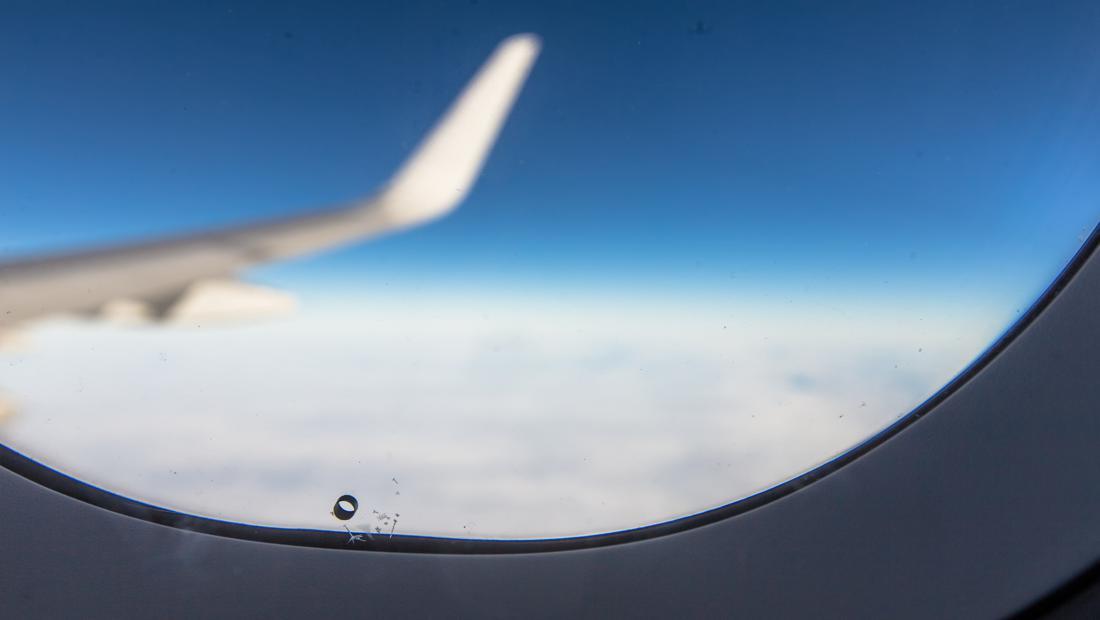 don t panic if you spot a small hole in the airplane window 20397b4