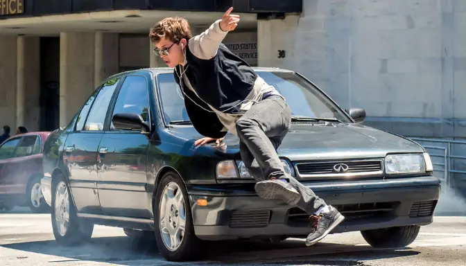 Sinopsis Film Baby Driver: Kisah Pengemudi Muda yang Ingin Lepas dari Dunia Kejahatan 2 Aksi Ansel Elgort (Miles "Baby") di Film Baby Driver